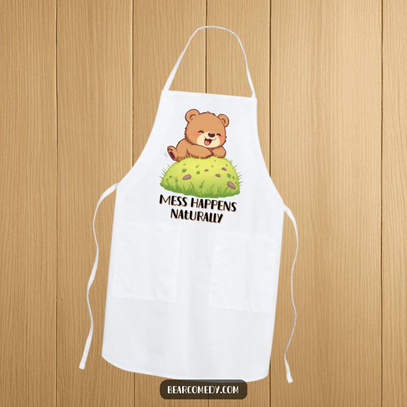 Funny apron illustrated with a bear cub rolling down a green hill, perfect for adding a touch of playful energy to kitchen activities.