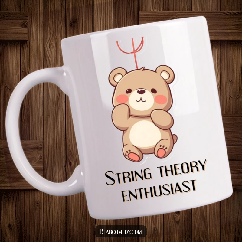 Funny bear mug showing a playful bear character enthusiastically batting at a dangling, bright red string with its paws.
