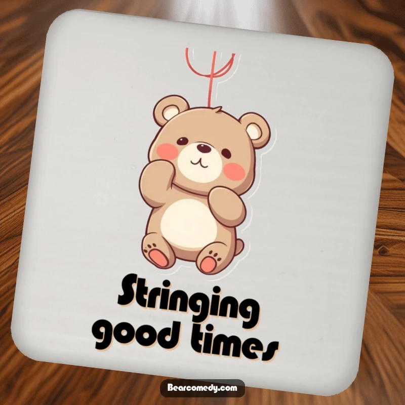 Funny bear coaster featuring a playful bear character batting at a bright, dangling string with an engaged and happy expression.