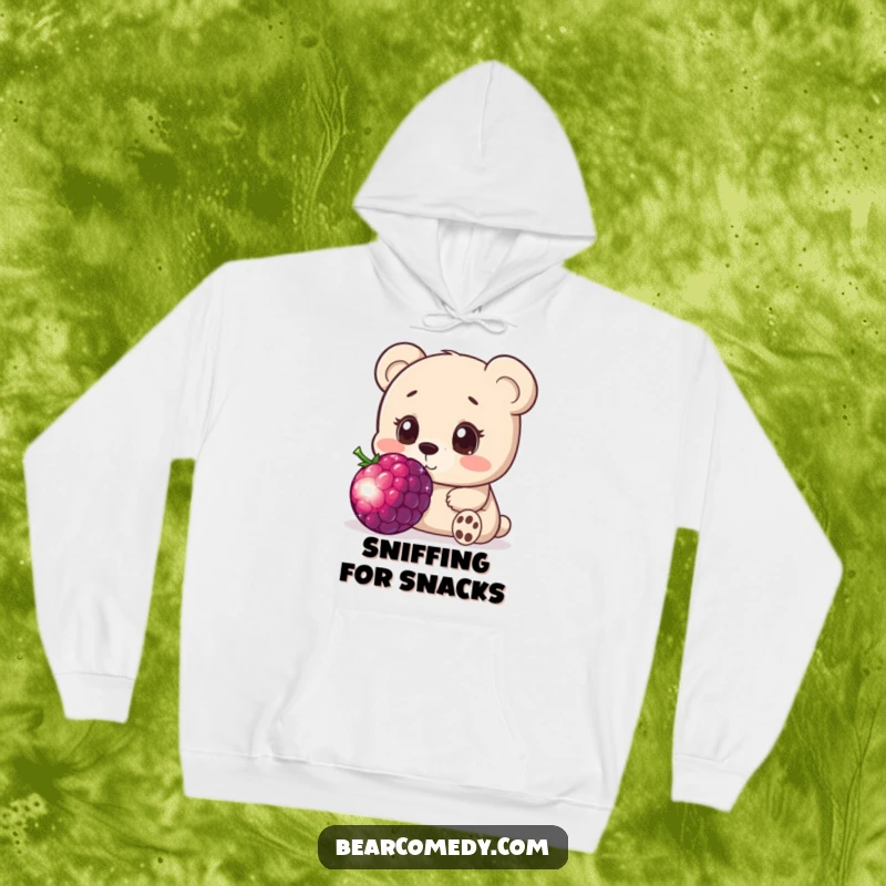 Funny hoodie showcasing a bear character with wide, innocent eyes, curiously exploring a giant, sparkling berry with gentle fascination.
