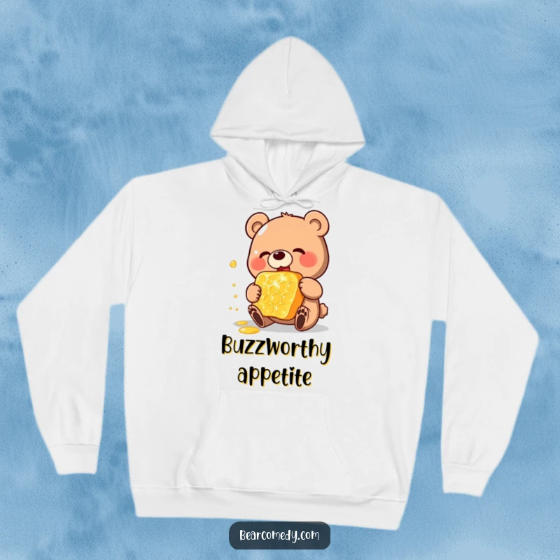 Funny hoodie featuring a happy bear character enthusiastically eating a gigantic, shimmering honeycomb, offering comfort and a cheerful vibe.