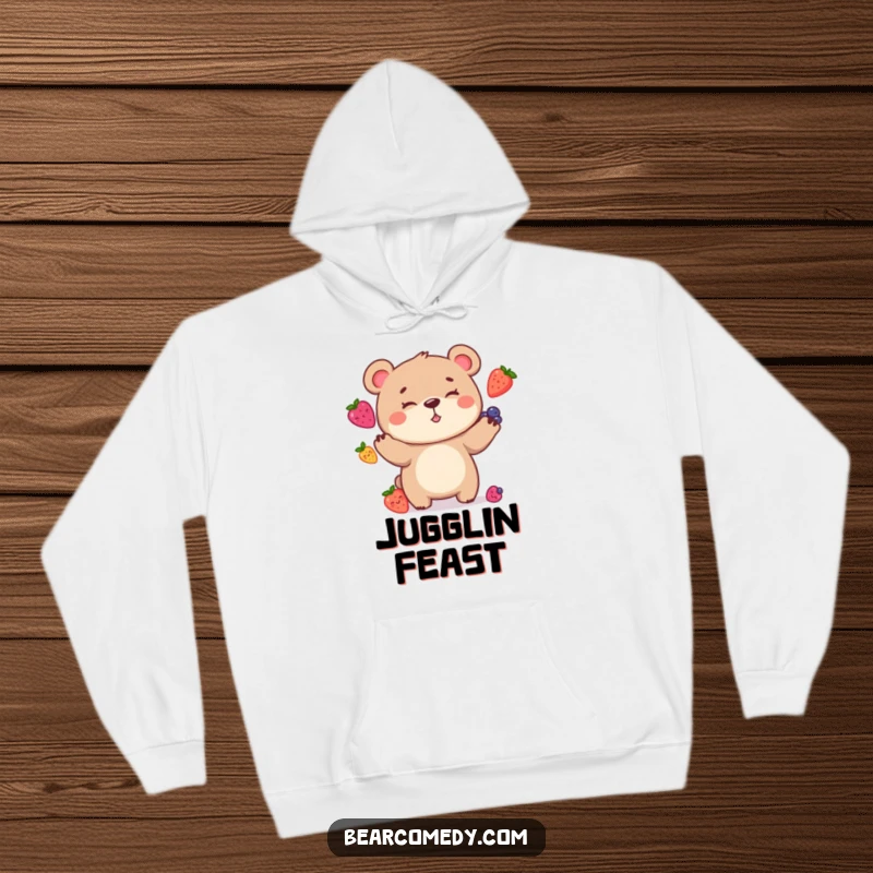 Funny Hoodie showing a bear character with a goofy grin, comically juggling berries, blending cozy comfort with hilarious, playful antics.