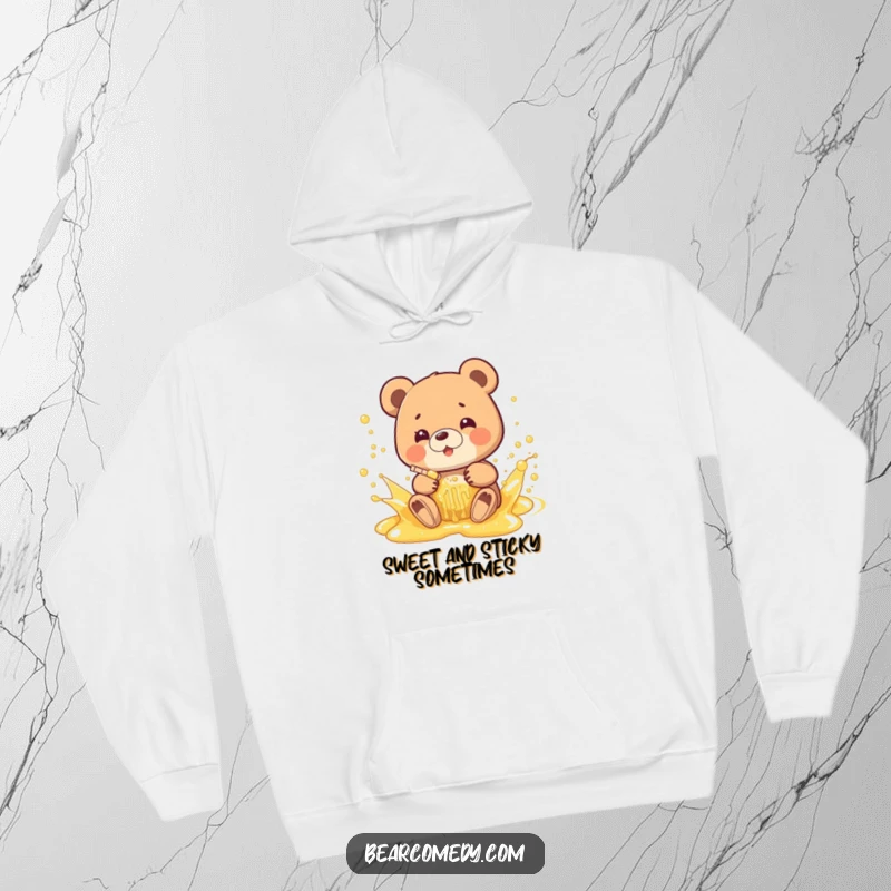 Funny hoodie showcasing a bear joyfully splashing in a bubbly, golden honey stream, perfect for cozying up with a smile.