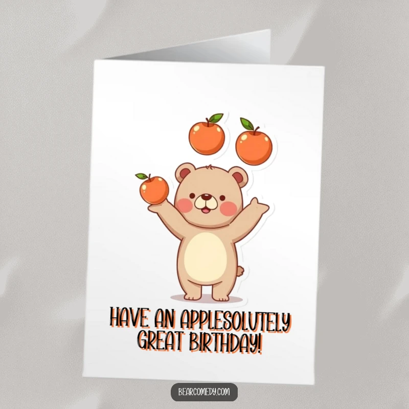 Funny Free Printable Birthday Card: Jolly bear playfully tossing three juicy apples in the air with a smile.