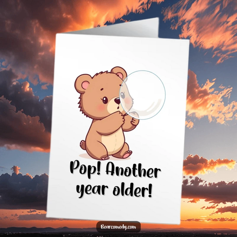 Funny Free Printable Birthday Card: A bear cub playfully batting at a large, bouncing bubble, a fun downloadable gift.