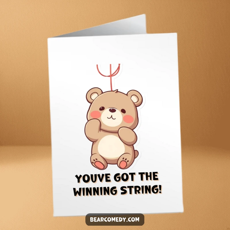 Funny Free Printable Congratulations Card: A bear gleefully batting at a dangling bright string with its paws.