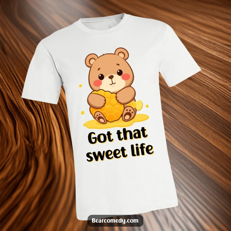 Funny t-shirt showcasing a round bear character with a wide, happy grin, embracing a huge honeycomb, celebrating sweet happiness.