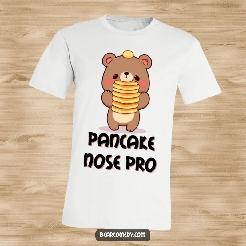 Funny bear character trying to balance a tall stack of pancakes on its nose, printed on a comfortable t-shirt.