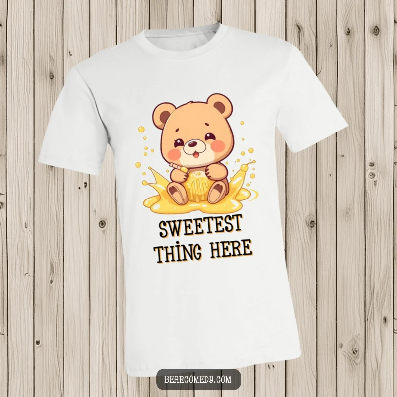 Funny t-shirt featuring a bear gleefully splashing in a stream of bubbly, golden honey, radiating pure happiness and fun.