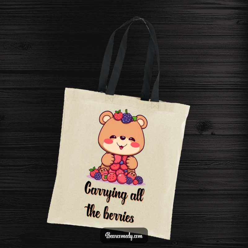 Funny tote bag depicting a bear with a wide, silly grin attempting to balance a tower of berries, bringing humor to everyday tasks.