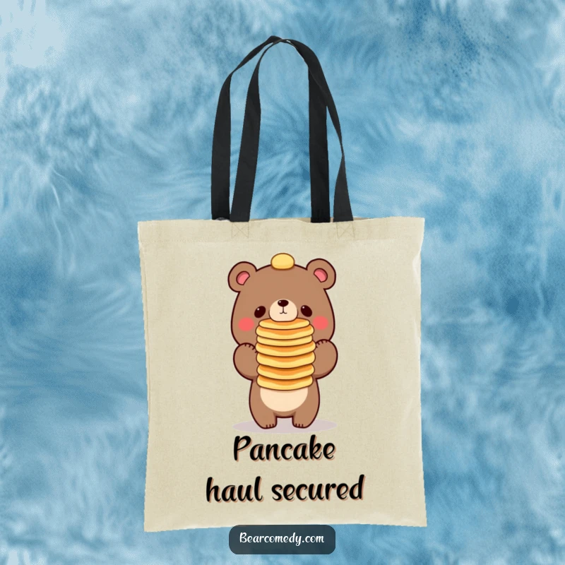 Funny bear character balancing a tall stack of pancakes on its nose, a practical tote bag for daily use.